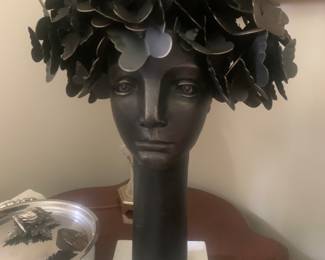 Butterflies for brains statue on marble base