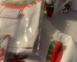 Large selection of VIETRI Old St Nick mugs, aprons, tablecloths baby bibs 