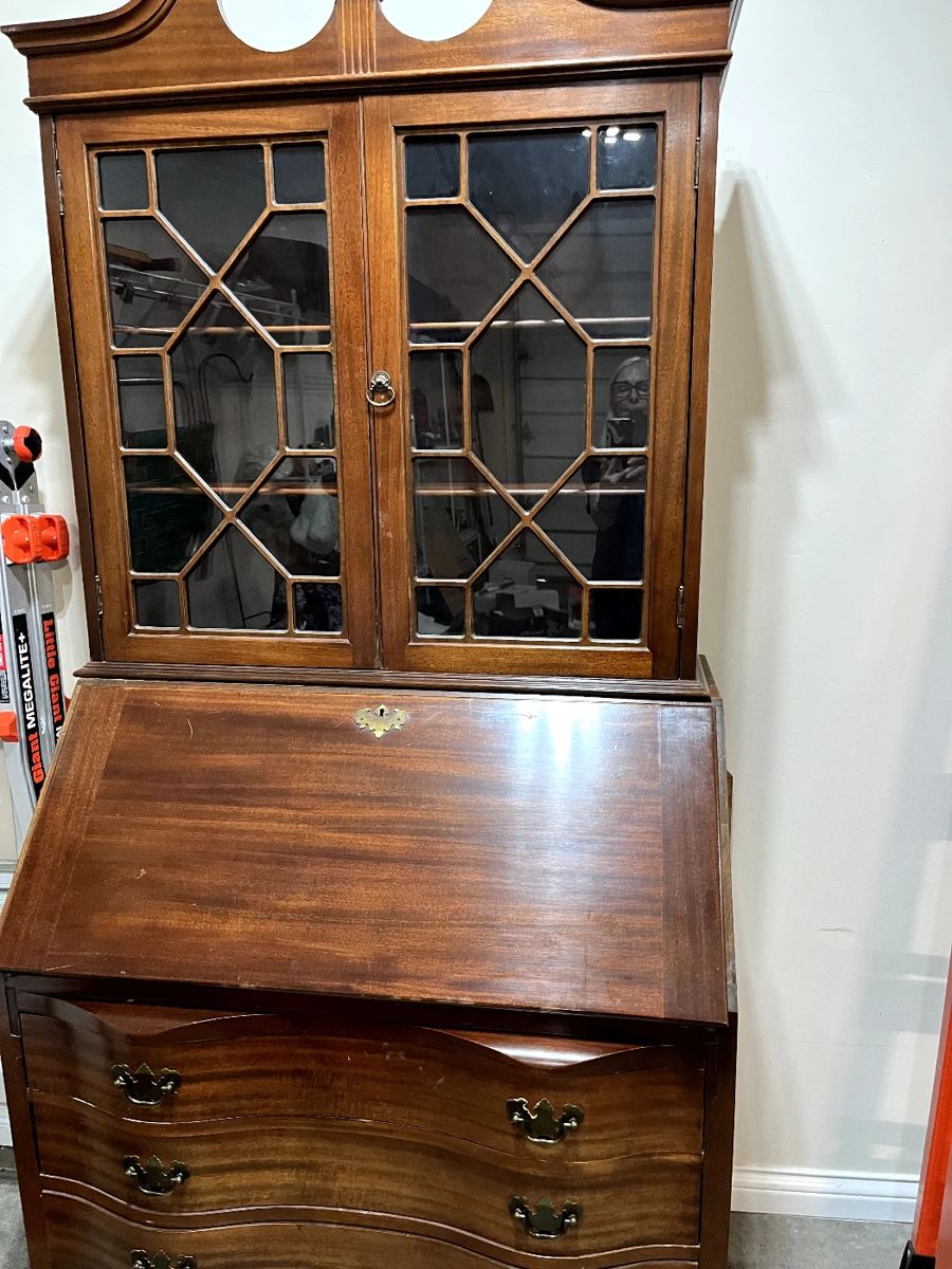 This gorgeous piece is a Maddox Secretary...stunning, classic and so useful! Makes a beautiful office with just pulling down the front piece. It's in such good condition, and would be a perfect addition to your living room, dining room or den.