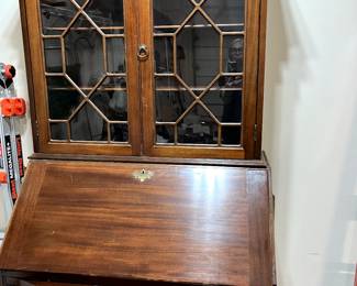 This gorgeous piece is a Maddox Secretary...stunning, classic and so useful! Makes a beautiful office with just pulling down the front piece. It's in such good condition, and would be a perfect addition to your living room, dining room or den.