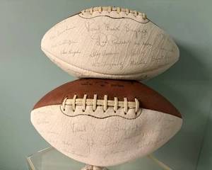 Signed footballs with Paul Bear Bryant and team