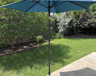 Blue Pattio Umbrella in Round Stand