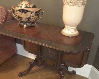 Gorgeous drop leaf table features marquetry inlay top and carved base and legs. Can be used for dining or a game table, excellent condition