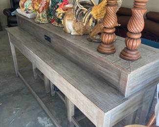Very unique to tiered sofa table with matching stools.