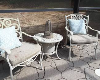 Cast powder coat metal porch or patio set. Table top lifts off to reveal a beverage container