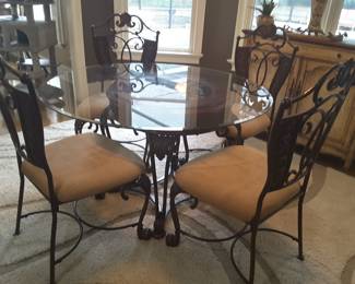 Glass top casual dining table and four chairs, very heavy.