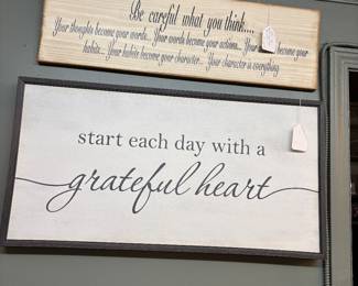 "Be careful what you think..." sign and "Start each day with a grateful heart" sign
