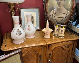 This cabinet slides open and is a server. Josephine and Napoleon Lamp Shades, African American framed portrait in convex frame.