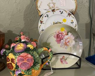 Beautifully painted plates. Quaint Teapots