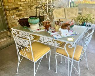LOVE THE YELLOW CUSHIONS AND SCROLLWORK OF THE METAL.