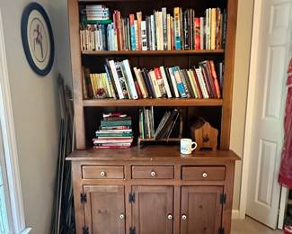 C48 - $95. Bookshelf with cabinets. Good condition. Measures 48" wide x 18.5" deep x 78" tall.