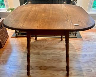 C25 - $80. Wooden Drop Leaf Table. Measures 40" x 35.5" x 29.25" tall. (Has 2 chairs with matching design. Included if you want them but they have been stored in the attic so the finish isn't as nice as the table)