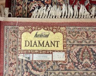 C24 - $125. Kurdistani Diamant Area Rug. 100% Pure New Zealand Wool. Measures 98" x 67". Shows a bit of wear around the edges but no major stains etc.