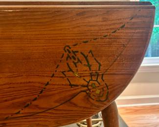 C25 - $80. Wooden Drop Leaf Table. Measures 40" x 35.5" x 29.25" tall. (Has 2 chairs with matching design. Included if you want them but they have been stored in the attic so the finish isn't as nice as the table)
