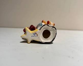 C142 - $10. Hummel "Angel with Teddy Bear" and candle holder. Measures 2.5" tall.