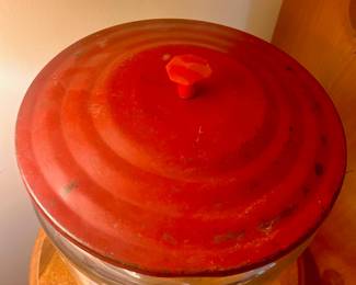 C135 - $200. 1950's Golden Flake Country Store Counter Jar with Red Metal Lid. Measures 12" tall x 9.5" wide. (Octagonal finial has a chip which is shown in the pictures)