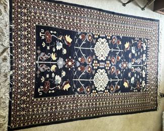 C49 - $75. Wool Rug - no tags. Measures 73" x 48".