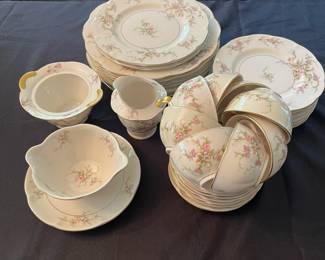 C38 - $140. Theodore Haviland New York "Rosalinde". Serving Platter, 7 dinner plates, 2 salad plates, 6 dessert plates, 7 teacup/saucers, creamer, sugar bowl (no lid), gravy dish. No chips/ cracks noted.