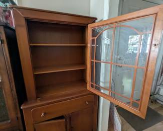 C34 - $125. Old Town Maple China Cabinet. Vintage - Solid Wood. Smaller size. Measures 32" wide x 15" deep x 62" tall. Doors work well - drawer is slightly sticky. One knob is broken and has minor scratching.