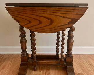 C1 - $350. Baker Furniture. Style 7709. *Small* Round Drop Leaf Table with Barley Twist Legs. Measures 24" round x 24" tall. 8" wide with leaves are down. Very good vintage condition! Traditional barley twist legs on the table and the gates, with lower box stretcher for stability and support.
