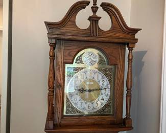C31 - $275. Howard Miller Grandfather Clock. Model 610169. Measures 16" wide x 10" deep x 75" tall.