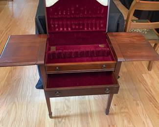 C114 - $100. Oneida Anti-Tarnish Drop leaf cabinet. Measures 22.5" wide (40.5" when open) x 13" deep x 26" tall.
