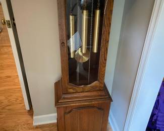 C31 - $275. Howard Miller Grandfather Clock. Model 610169. Measures 16" wide x 10" deep x 75" tall.