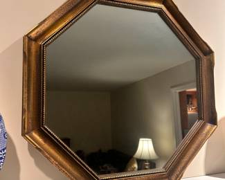 C35 - $30. Small Wooden Framed Hexagon Wall Mirror. Measures 21.5" in all directions.