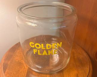 C136 - $90. Golden Flake Jar. Measures 7.5" tall x 7.5" wide. No lid.
