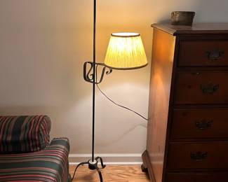 C80 - $50. Vintage Wrought Iron Floor Lamp with adjustable swing arm. Lamp shade is in good condition. Measures 55.5" tall.