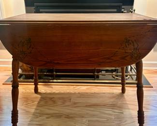 C25 - $80. Wooden Drop Leaf Table. Measures 40" x 35.5" x 29.25" tall. (Has 2 chairs with matching design. Included if you want them but they have been stored in the attic so the finish isn't as nice as the table)