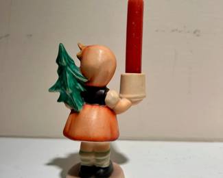 C144 - $10. Goebel Hummel Figurine Advent Candlestick Girl with Fir Tree #116. Measures 3.5" tall. Minor crazing.