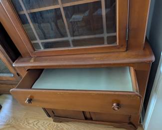 C34 - $125. Old Town Maple China Cabinet. Vintage - Solid Wood. Smaller size. Measures 32" wide x 15" deep x 62" tall. Doors work well - drawer is slightly sticky. One knob is broken and has minor scratching.