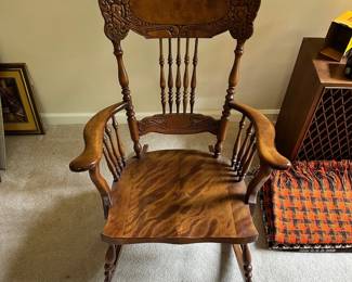 C123 - $125. Ornate Carved Wooden Rocking Chair. Measures 39" tall. 16" Floor to Seat.