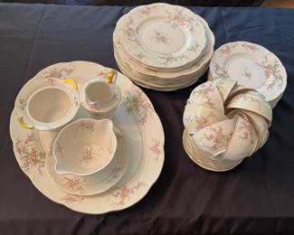 C38 - $140. Theodore Haviland New York "Rosalinde". Serving Platter, 7 dinner plates, 2 salad plates, 6 dessert plates, 7 teacup/saucers, creamer, sugar bowl (no lid), gravy dish. No chips/ cracks noted.