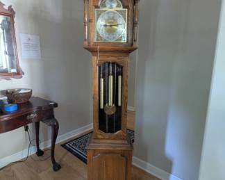 C31 - $275. Howard Miller Grandfather Clock. Model 610169. Measures 16" wide x 10" deep x 75" tall.