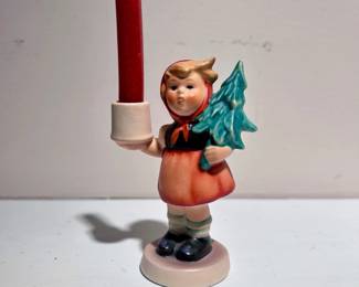 C144 - $10. Goebel Hummel Figurine Advent Candlestick Girl with Fir Tree #116. Measures 3.5" tall. Minor crazing.