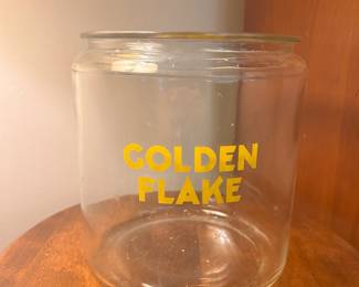 C136 - $90. Golden Flake Jar. Measures 7.5" tall x 7.5" wide. No lid.