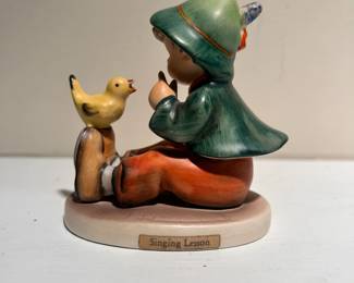 C145 - $10. Hummel "Singing Lesson". Measures 3" tall.