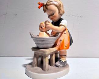 C137 - $10. Hummel Figurine "Doll Bath" . Measures 5" tall. (manufactured 1955-1959)
