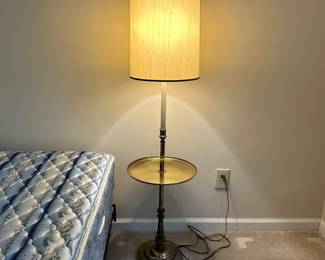 C106 - $100. Heavy Duty Brass Floor Lamp with Table. Measures 53" tall.
