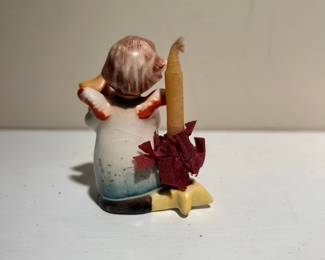 C142 - $10. Hummel "Angel with Teddy Bear" and candle holder. Measures 2.5" tall.