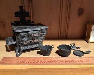 B61 - $40. Iron is Livitamin Queen Cast Iron Stove with accessories. Salesman sample size.