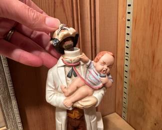 B84 - $12. Doctor & Baby Decanter. (Not sealed - empty)
