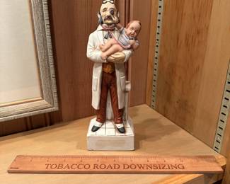B84 - $12. Doctor & Baby Decanter. (Not sealed - empty)
