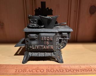 B61 - $40. Iron is Livitamin Queen Cast Iron Stove with accessories. Salesman sample size.