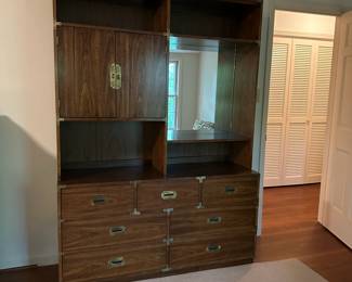 2 Piece Dresser / Desk Storage Campaign Style Cabinet. Assembled it measures 56" wide x 18" deep x 78.5" tall. (Top is 13" deep. Base is 18" deep. Top is 49" tall. Base is 29" tall.) All drawers slide. Doors work but could use a slight adjustment.
