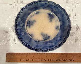 B104 - $20. Single Flow Blue Dinner Plate.