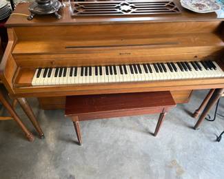 Piano Just moved to garage for easy buy It is on wheels