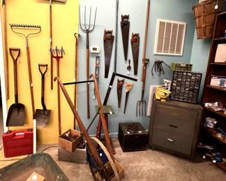 Tools galore, hand plow, wheelbarrow, Craftsman tool cabinet, etc.